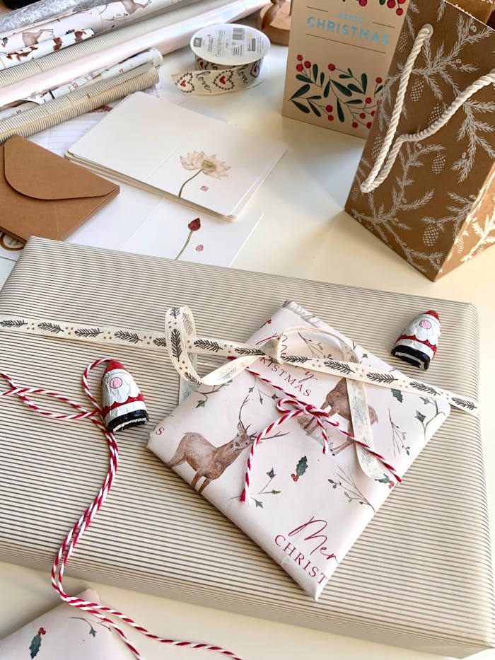 Christmas gift wrapping ideas featuring festive paper, ribbons, and decor.